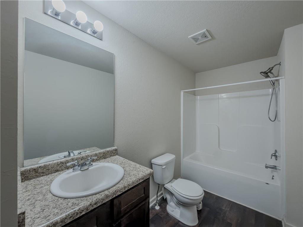 206 Morning Drive Athens, GA 30606 - Photo 22 of 36 a bathroom with a granite countertop sink toilet and shower