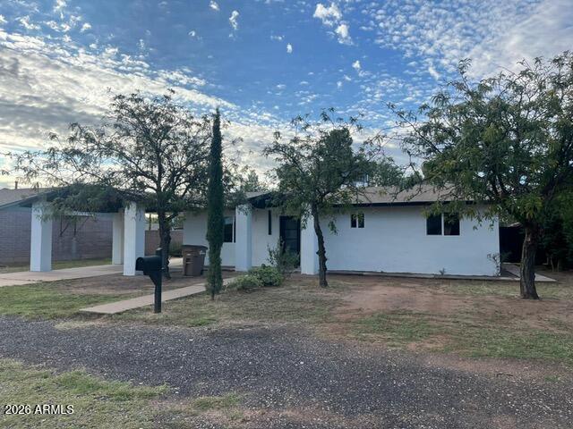 2435 East 13th Street Douglas, AZ 85607 - Photo 2 of 7 a front view of a house with garden