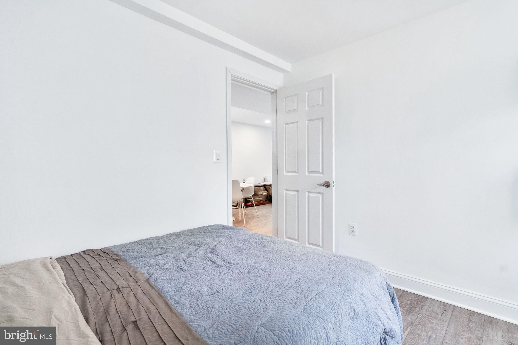 5020 River Road Bethesda, MD 20816 - Photo 20 of 36 a view of a room with a bed and a cabinets