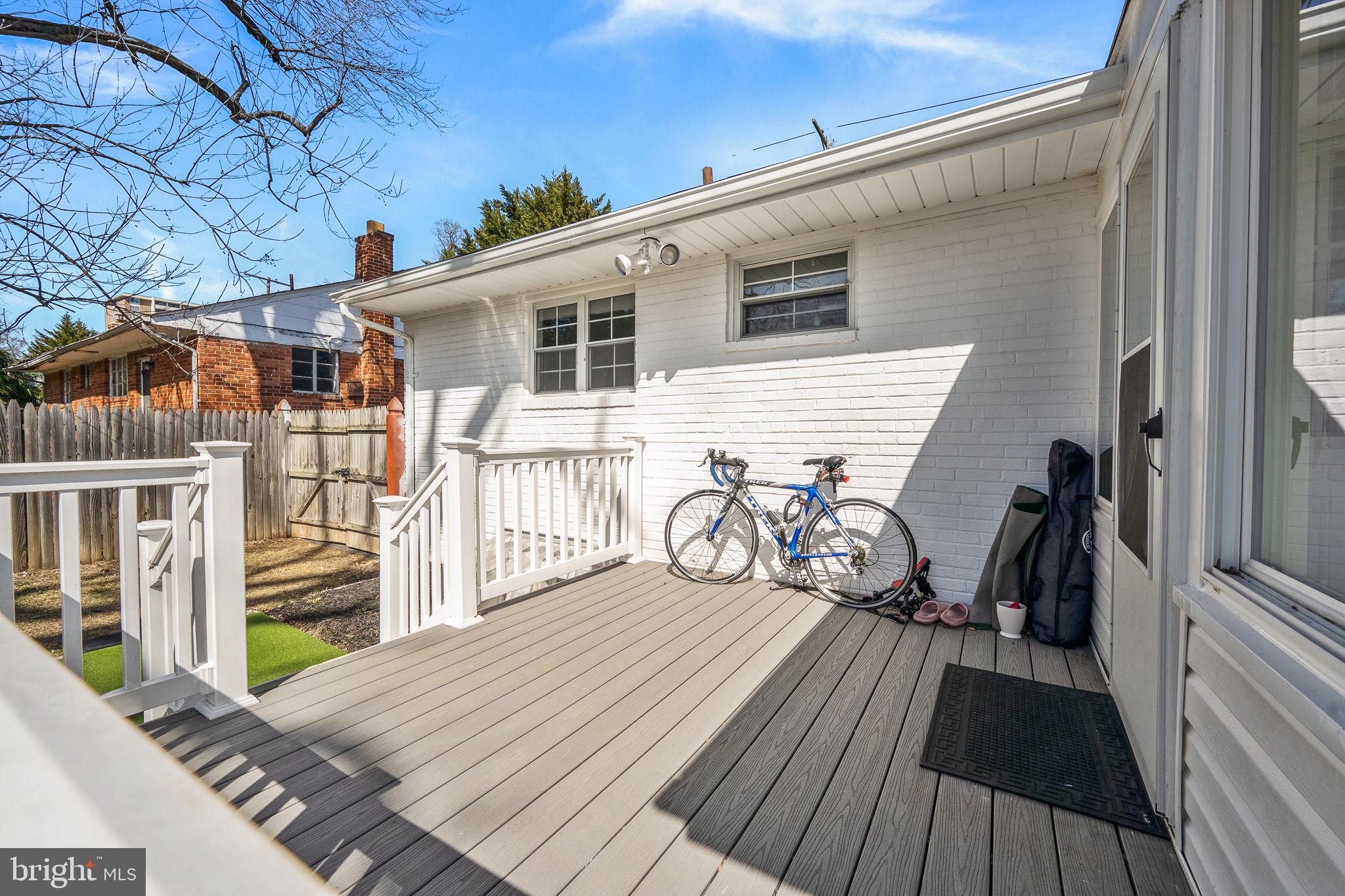 5020 River Road Bethesda, MD 20816 - Photo 36 of 36 a view of a house with a wooden deck