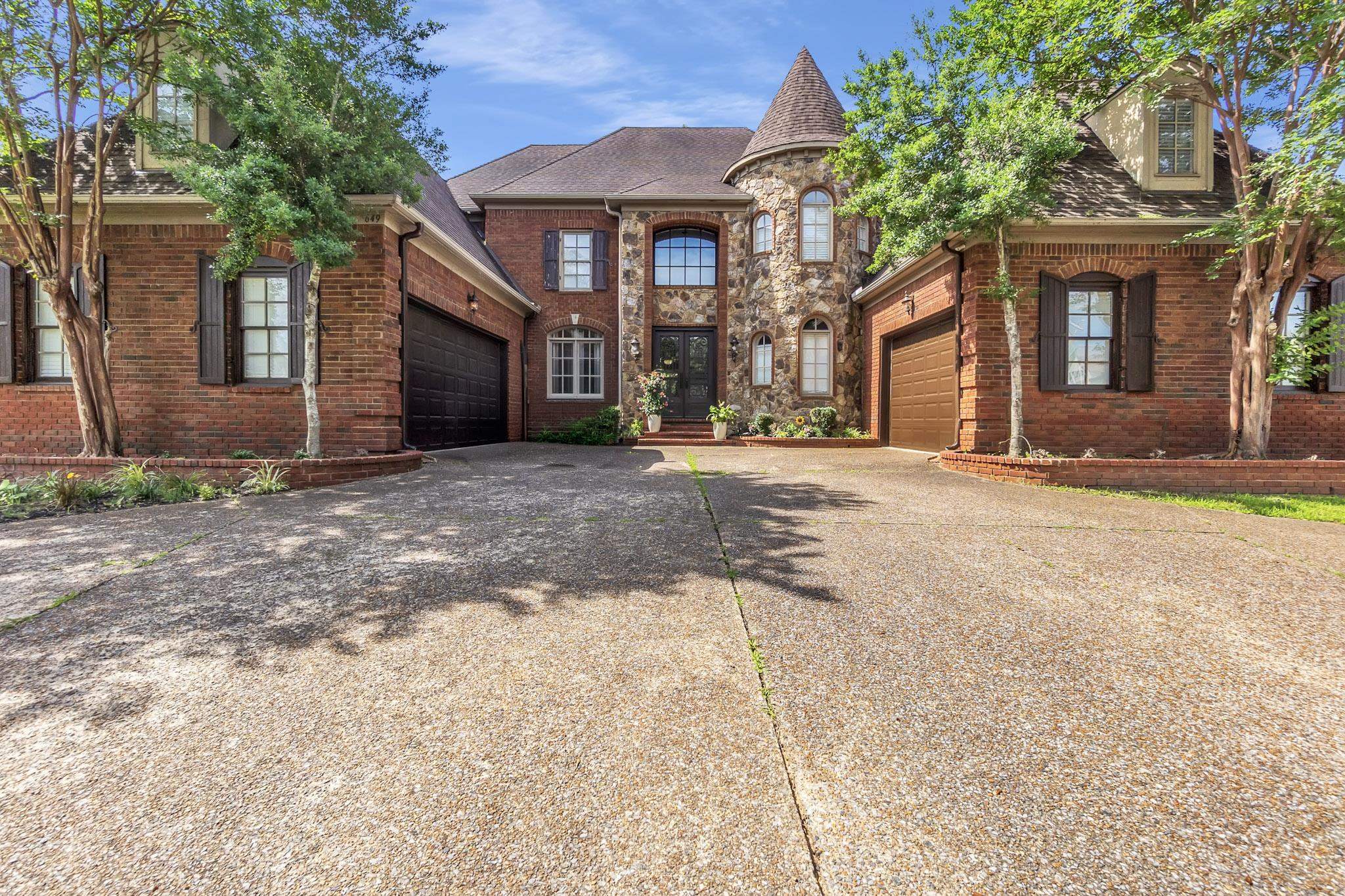 649 Ridge Springs Road Collierville, TN 38017 - Photo 1 of 38 a front view of a house with a yard and garage