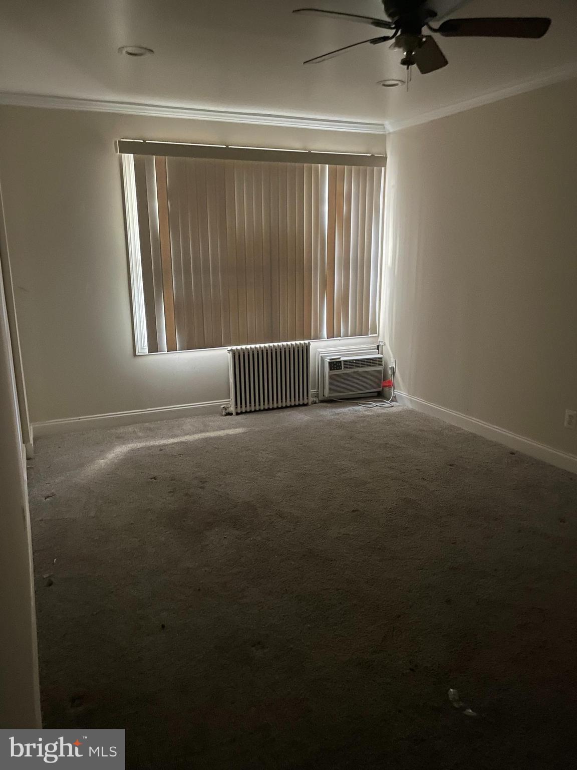 512 Ridge Road Southeast, Unit 105 Washington, DC 20019 - Photo 2 of 5 a view of empty room with windows