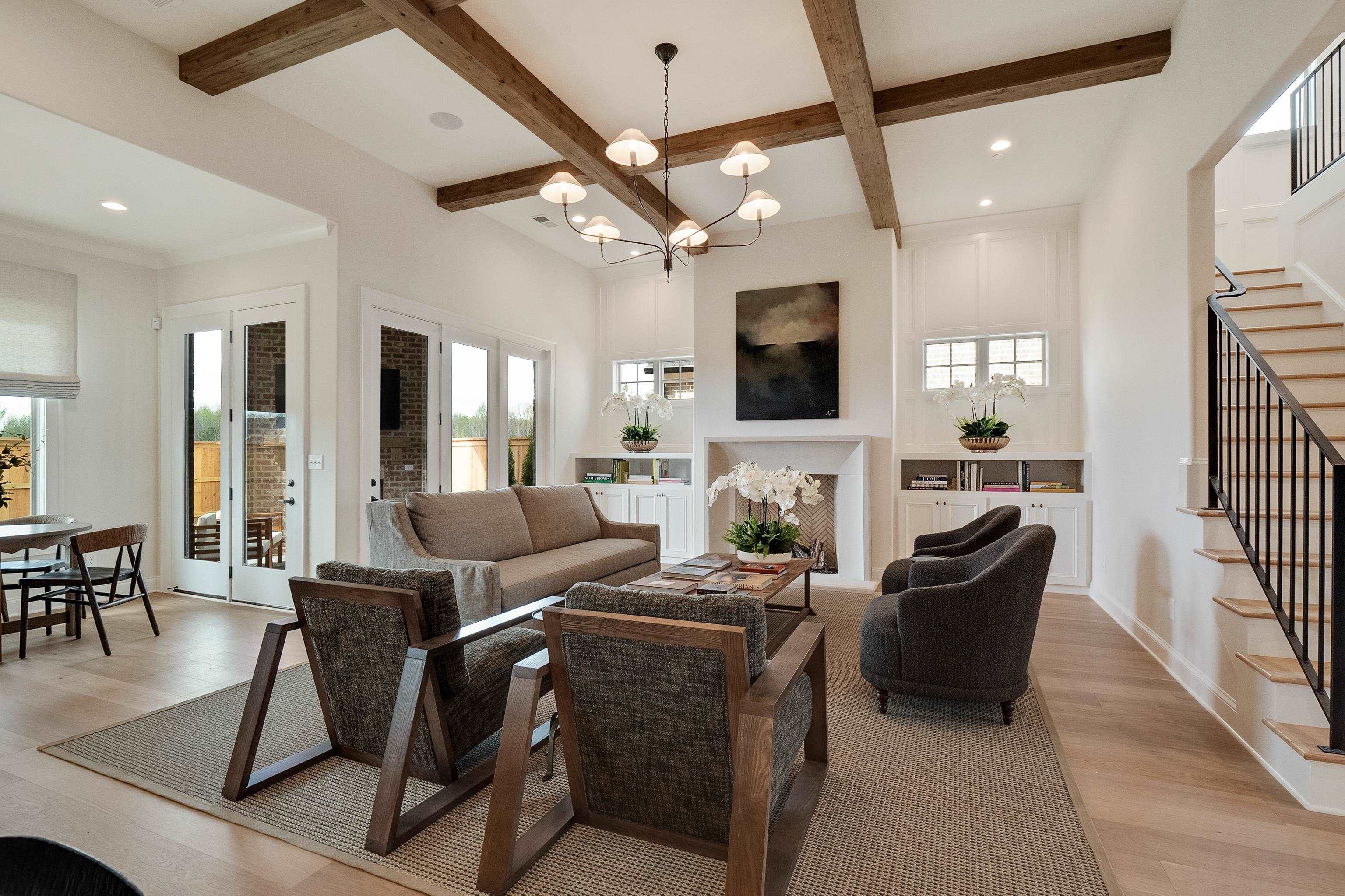 a living room with fireplace furniture and a flat screen tv