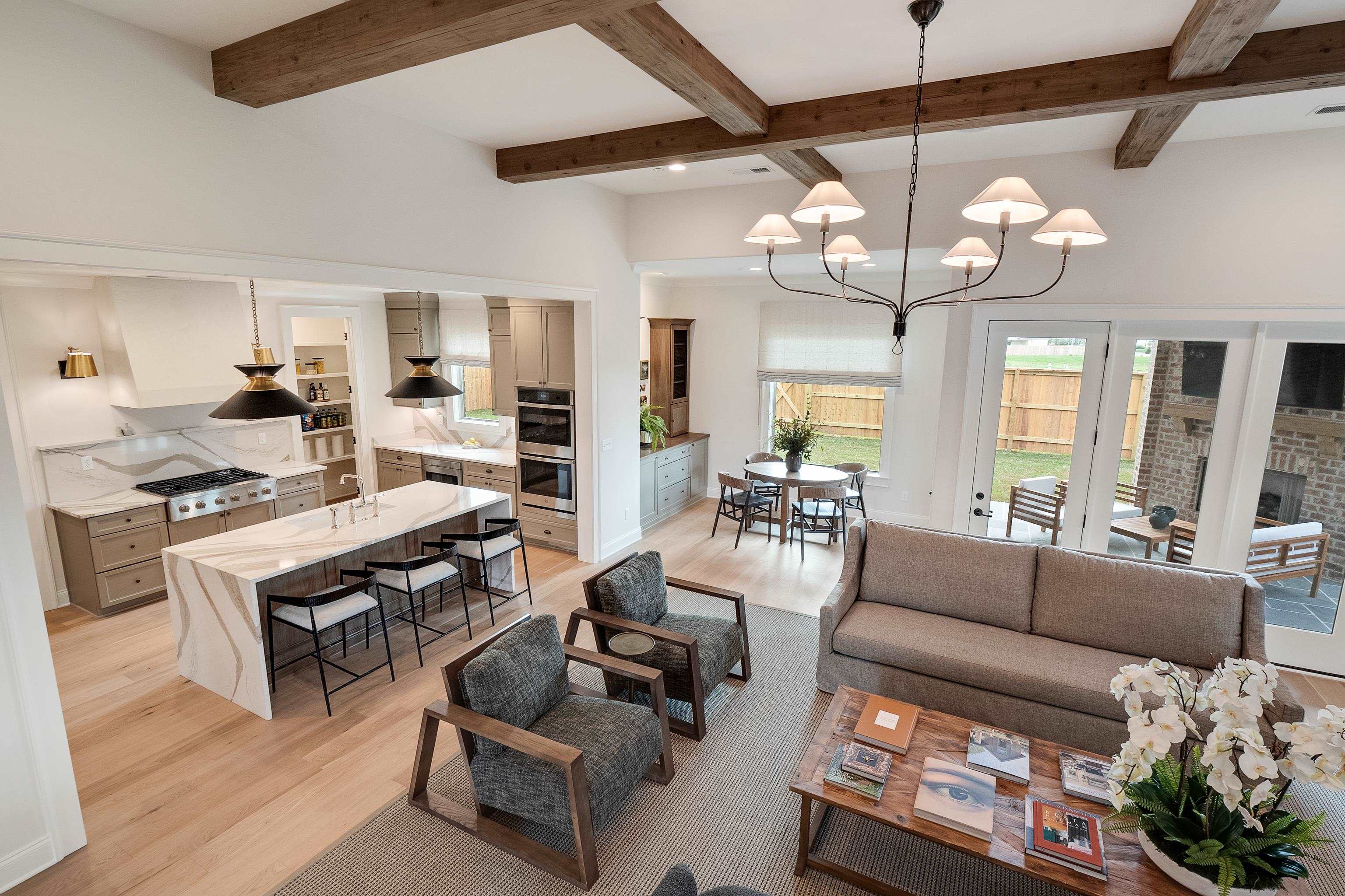 760 Cardinal Cove Collierville, TN 38017 - Photo 11 of 40 a living room with furniture kitchen view and a chandelier