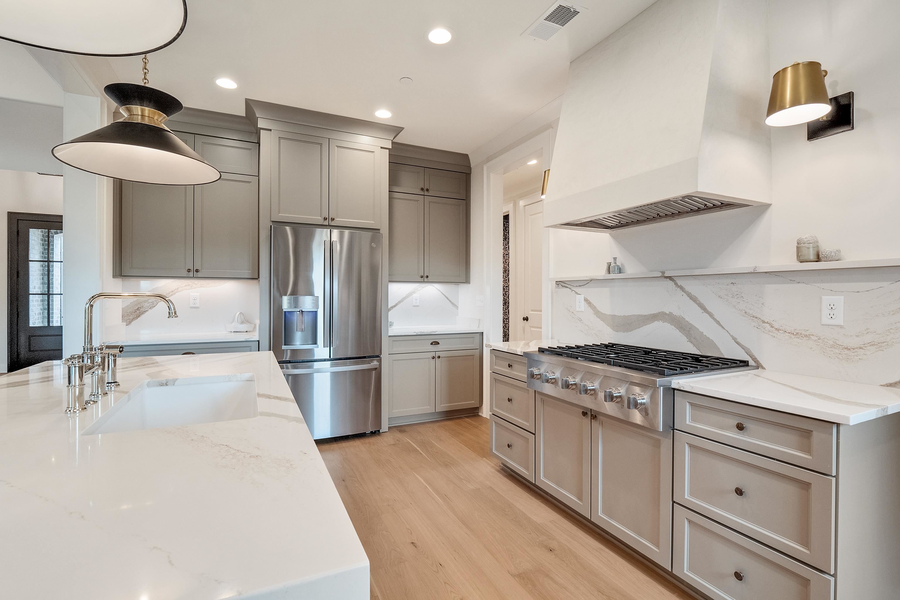 760 Cardinal Cove Collierville, TN 38017 - Photo 13 of 40 a kitchen with a stove a refrigerator and a sink
