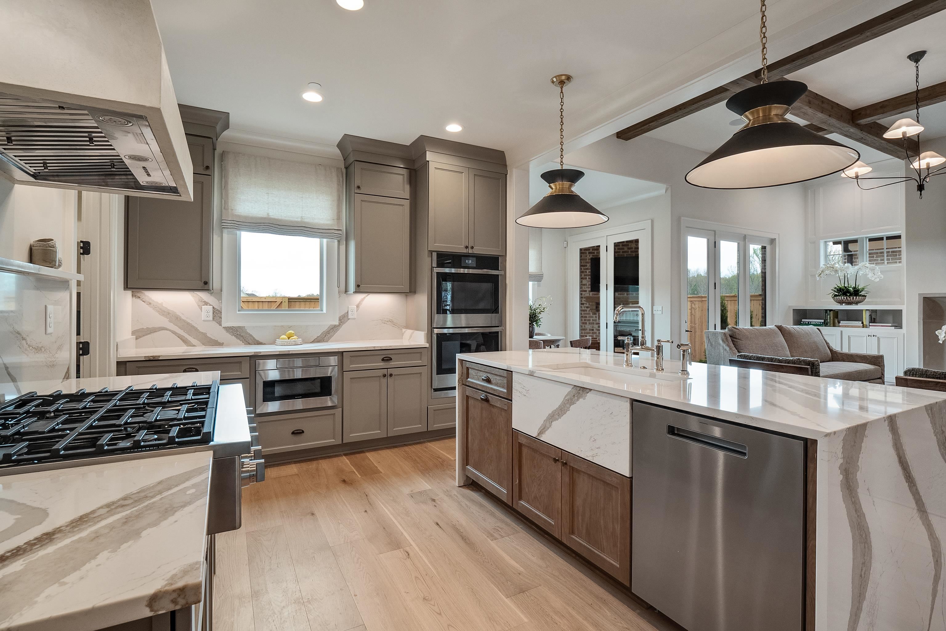 760 Cardinal Cove Collierville, TN 38017 - Photo 15 of 40 a kitchen with stainless steel appliances kitchen island granite countertop a stove and a sink