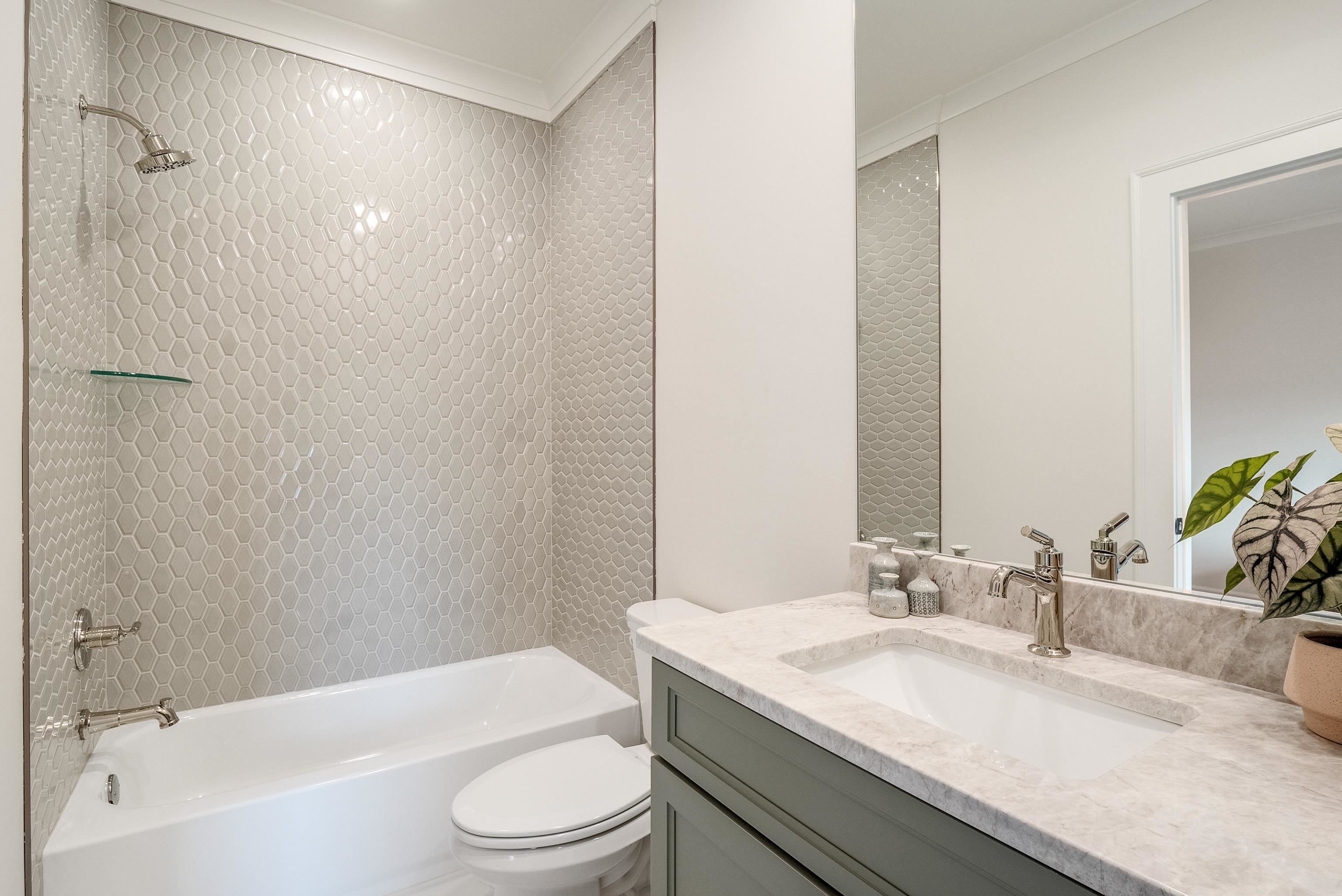760 Cardinal Cove Collierville, TN 38017 - Photo 32 of 40 a bathroom with a granite countertop sink toilet and shower