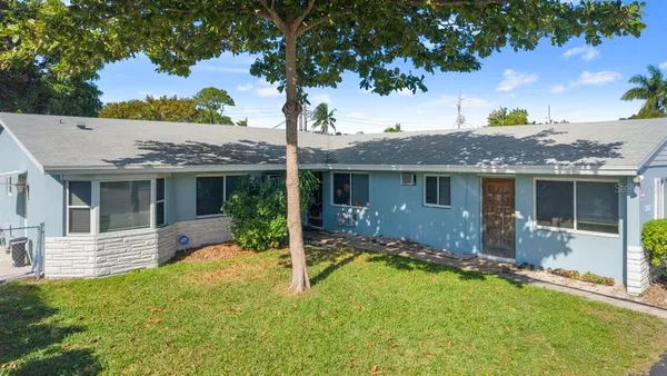 front view of a house with a yard