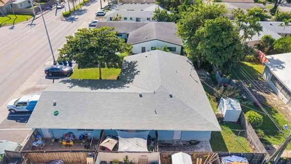an aerial view of a house with a swimming pool