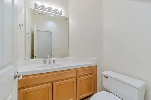 a view of a house with a tree in front