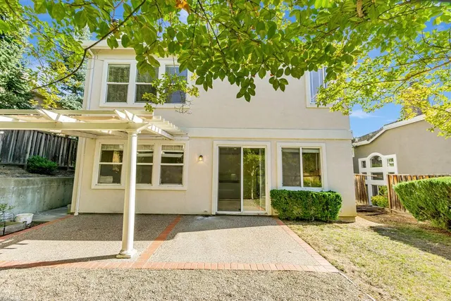 a house view with a backyard space