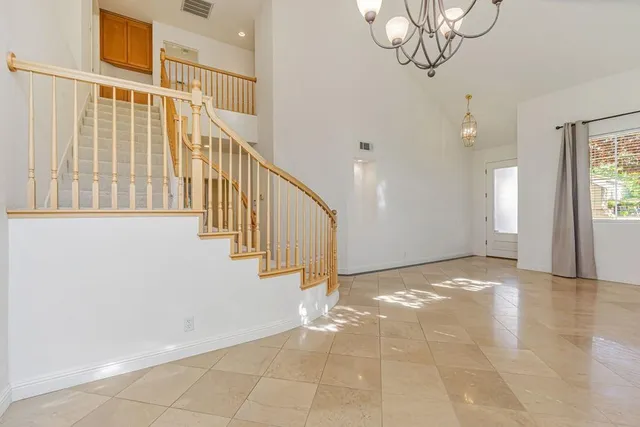 a kitchen with stainless steel appliances granite countertop a sink and a stove