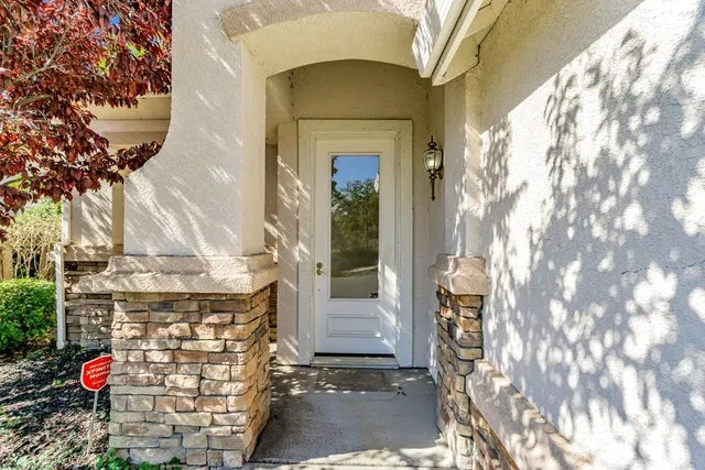a kitchen with stainless steel appliances granite countertop a sink and a refrigerator