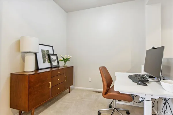 a view of workspace with lounge chair