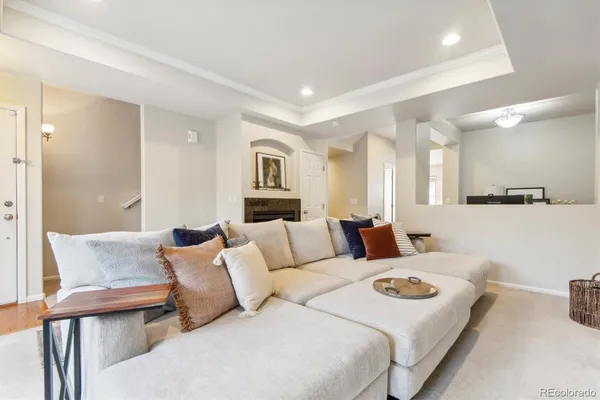 a large bedroom with a bed and glass table