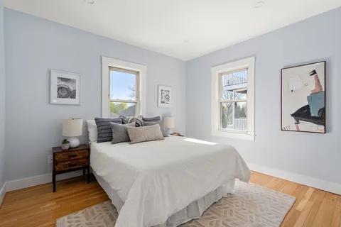 a bedroom with bed and window