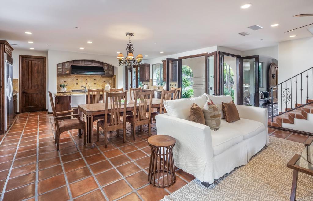 1133 Hermes Avenue Encinitas, CA 92024 - Photo 12 of 40 a living room with furniture a large window and kitchen view