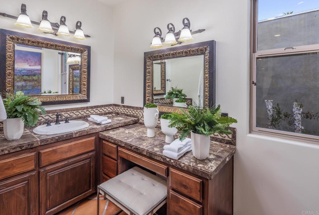 1133 Hermes Avenue Encinitas, CA 92024 - Photo 26 of 40 a kitchen with a sink and cabinets