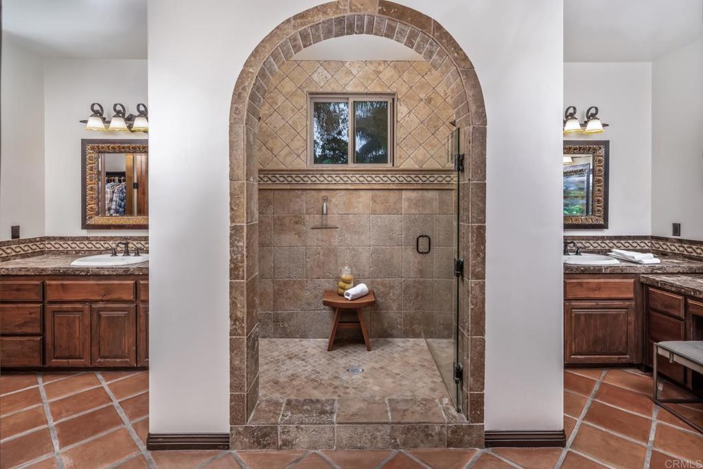 1133 Hermes Avenue Encinitas, CA 92024 - Photo 27 of 40 a bathroom with a sink and a mirror