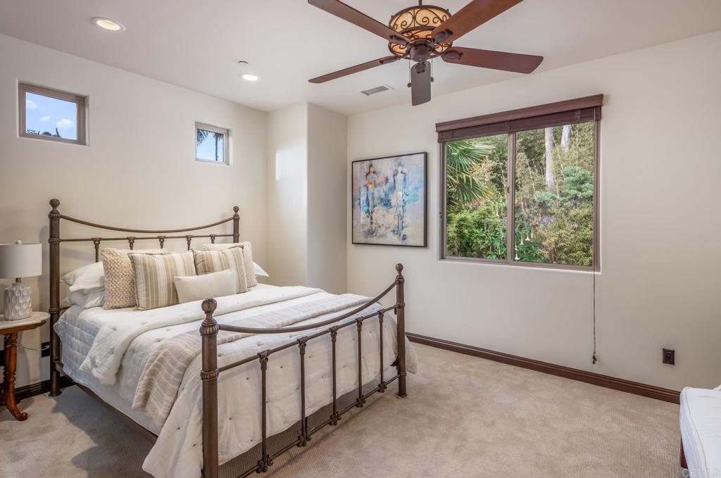 1133 Hermes Avenue Encinitas, CA 92024 - Photo 31 of 40 a bedroom with a bed and a window