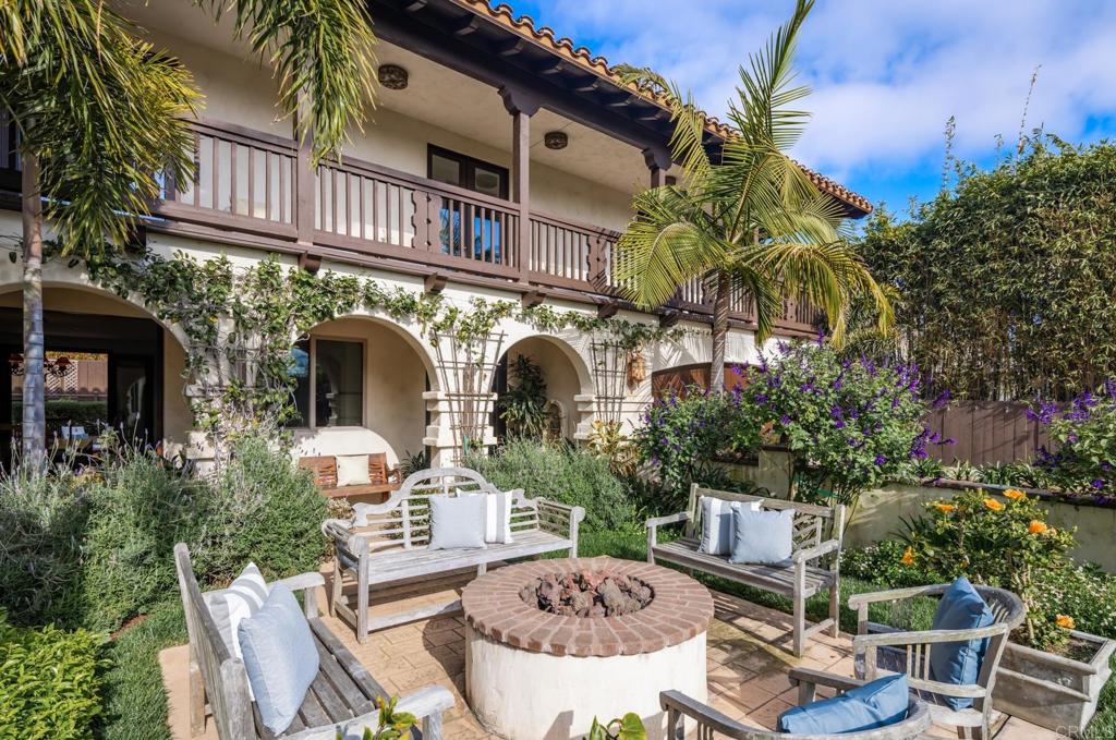 1133 Hermes Avenue Encinitas, CA 92024 - Photo 8 of 40 a view of a chairs and table in backyard