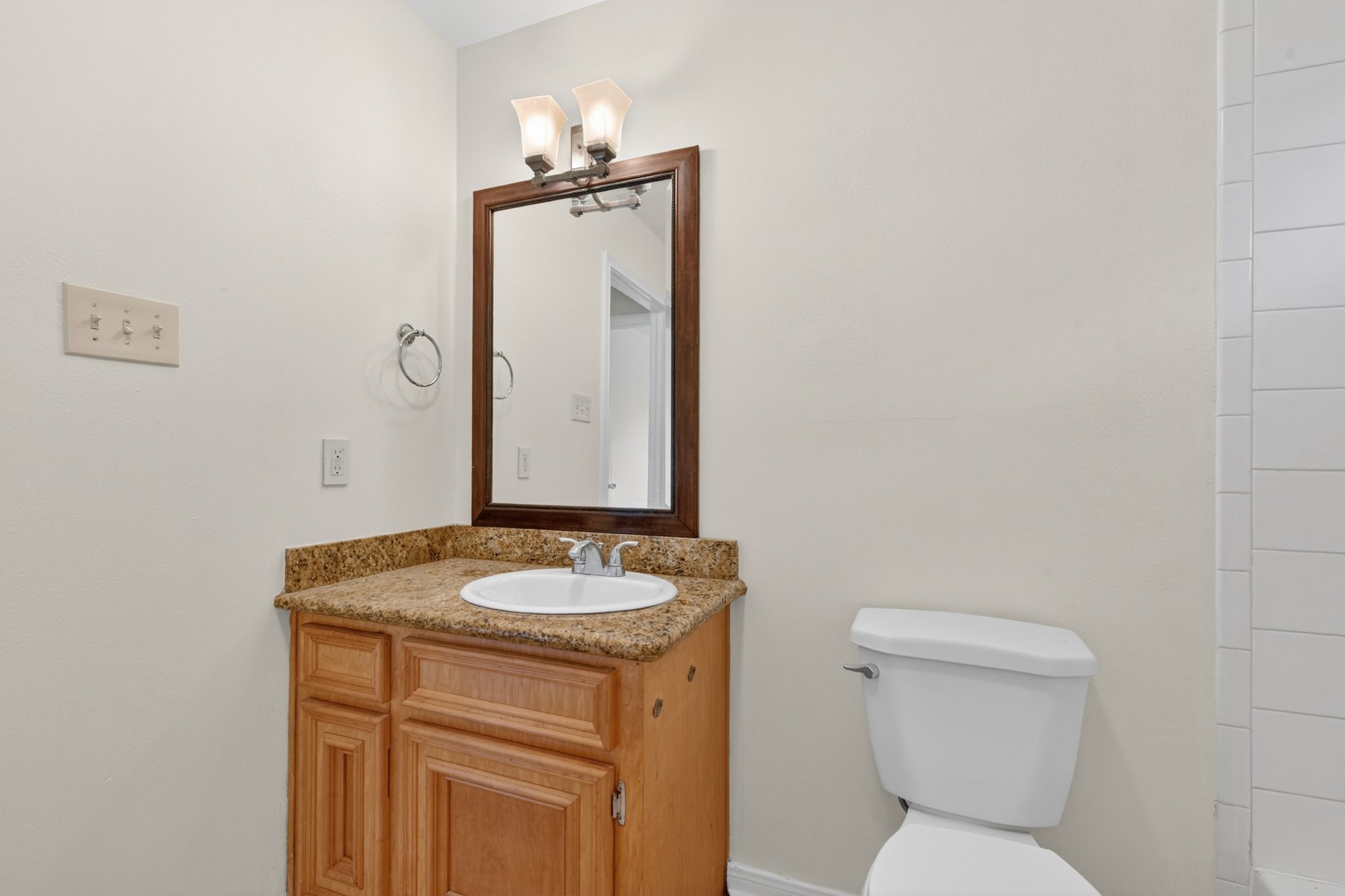 7013 St Augustine Street Houston, TX 77021 - Photo 25 of 35 a bathroom with a toilet sink and mirror