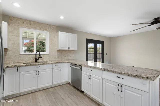 a kitchen with stainless steel appliances a refrigerator microwave and stove