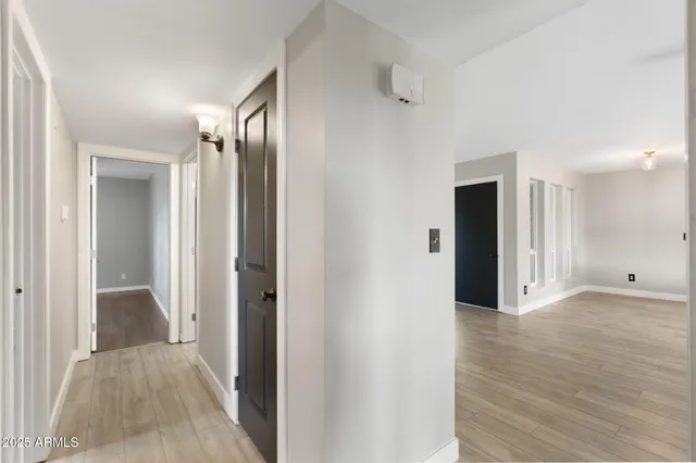 a bathroom with a sink a toilet a mirror and shower