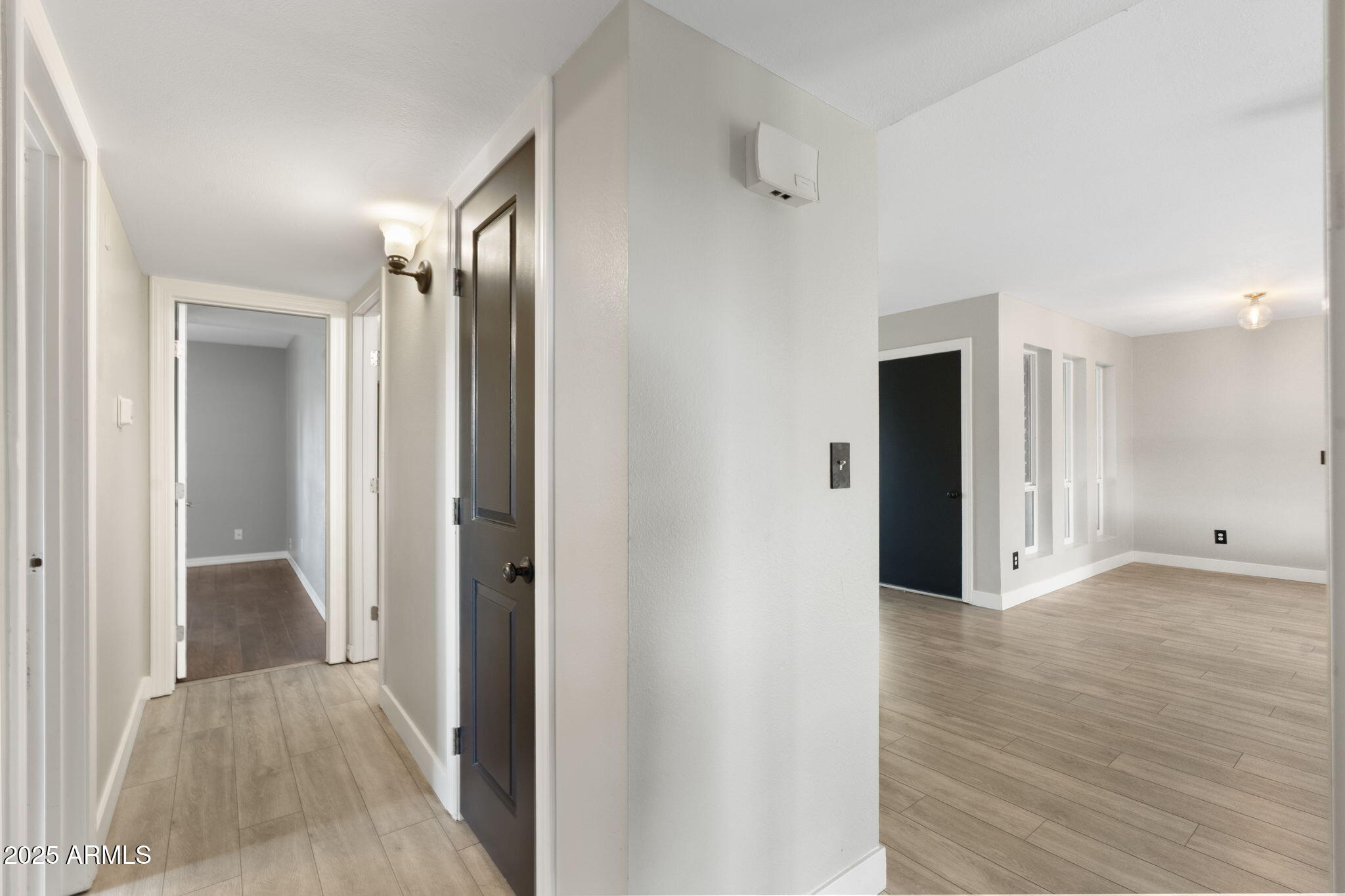 17 South Cholla Street Gilbert, AZ 85233 - Photo 19 of 37 a view of a hallway with wooden floor
