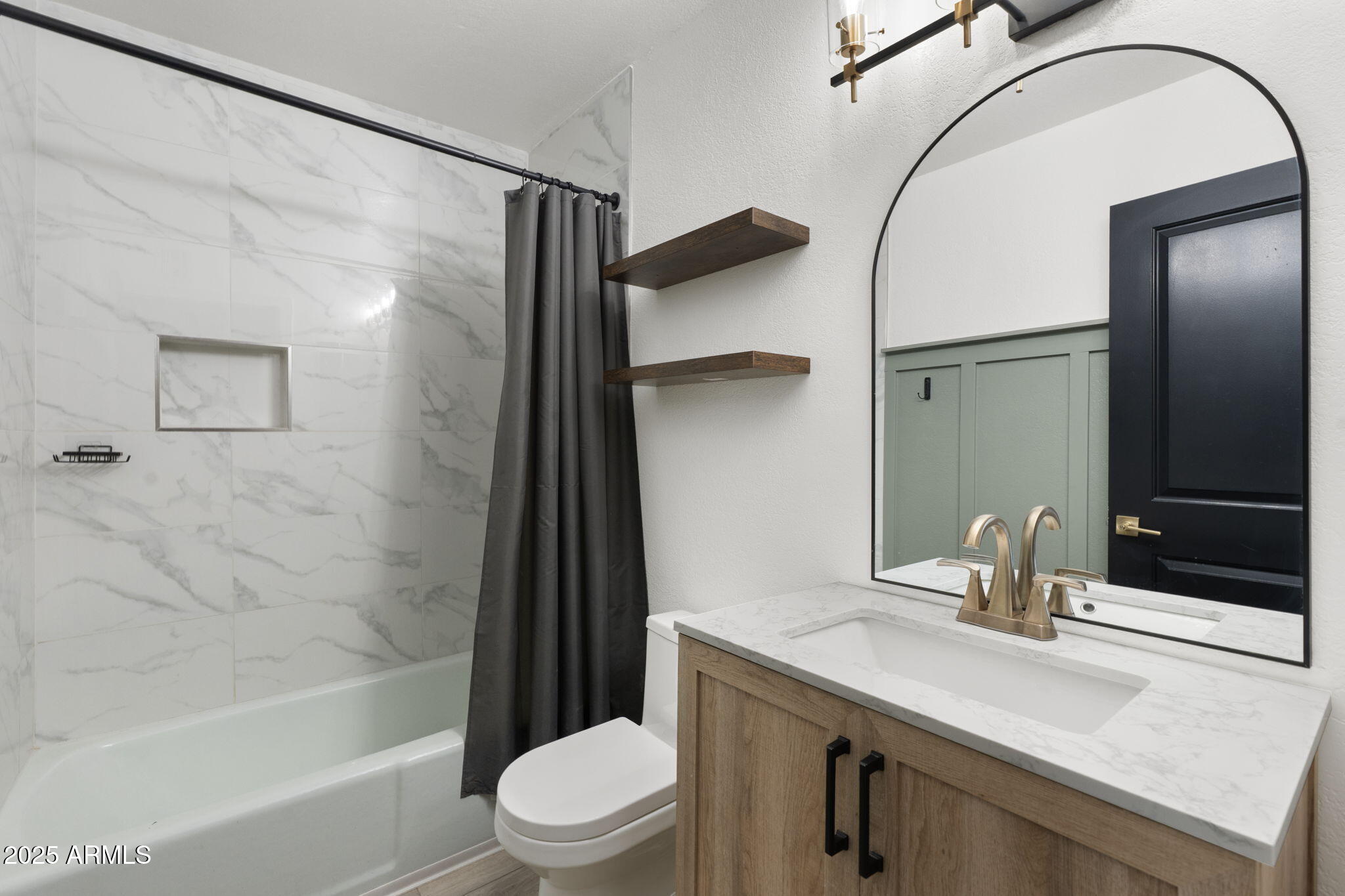 17 South Cholla Street Gilbert, AZ 85233 - Photo 20 of 37 a bathroom with a sink a toilet a mirror and shower