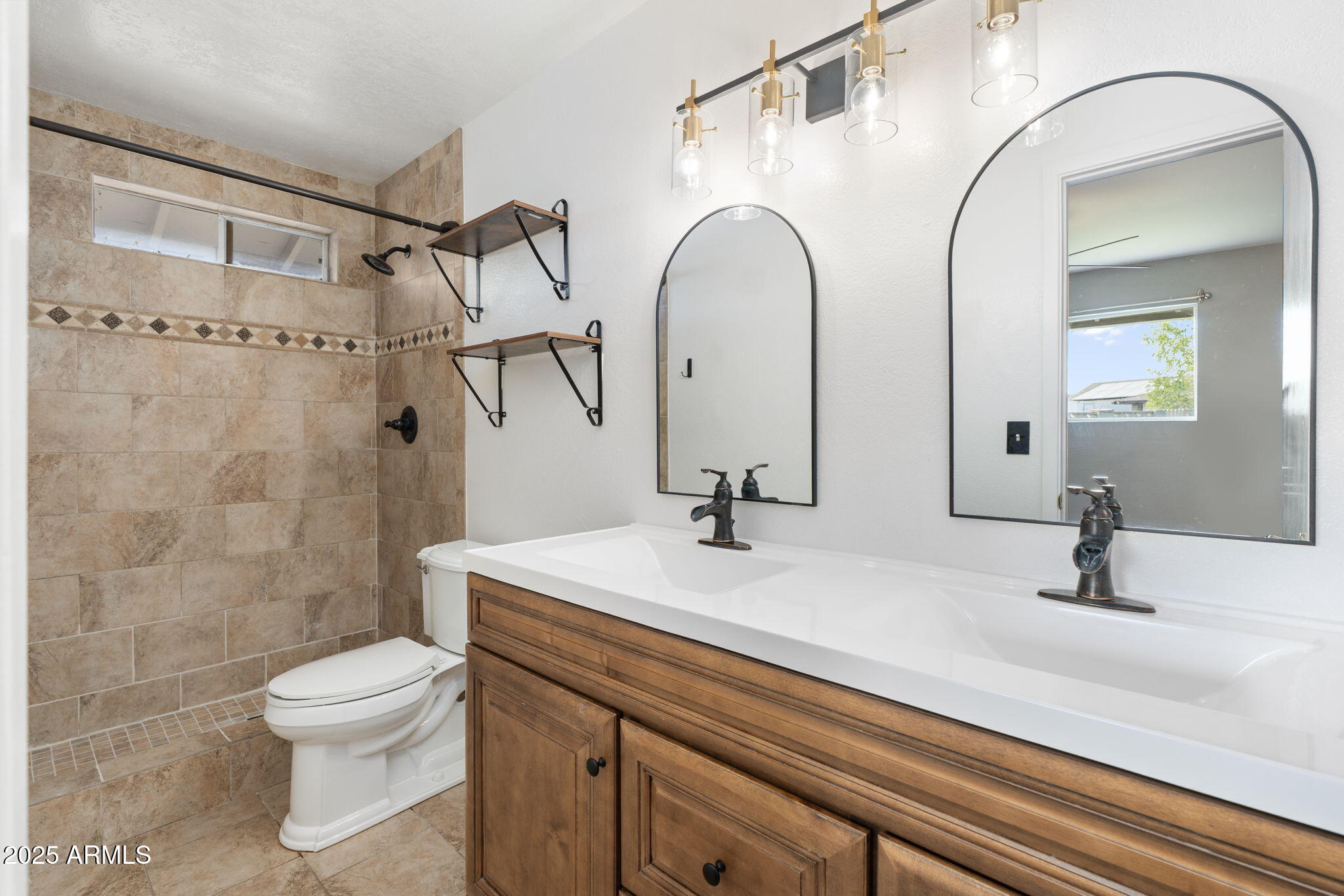 17 South Cholla Street Gilbert, AZ 85233 - Photo 24 of 37 a bathroom with a sink and mirror