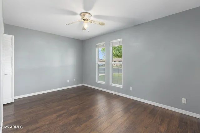 a view of an empty room with a fan