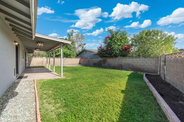 a view of a backyard with garden