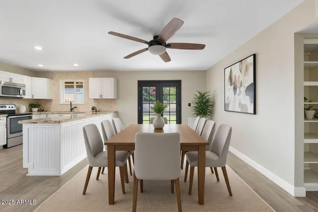 a view of a kitchen with wooden floor and a window