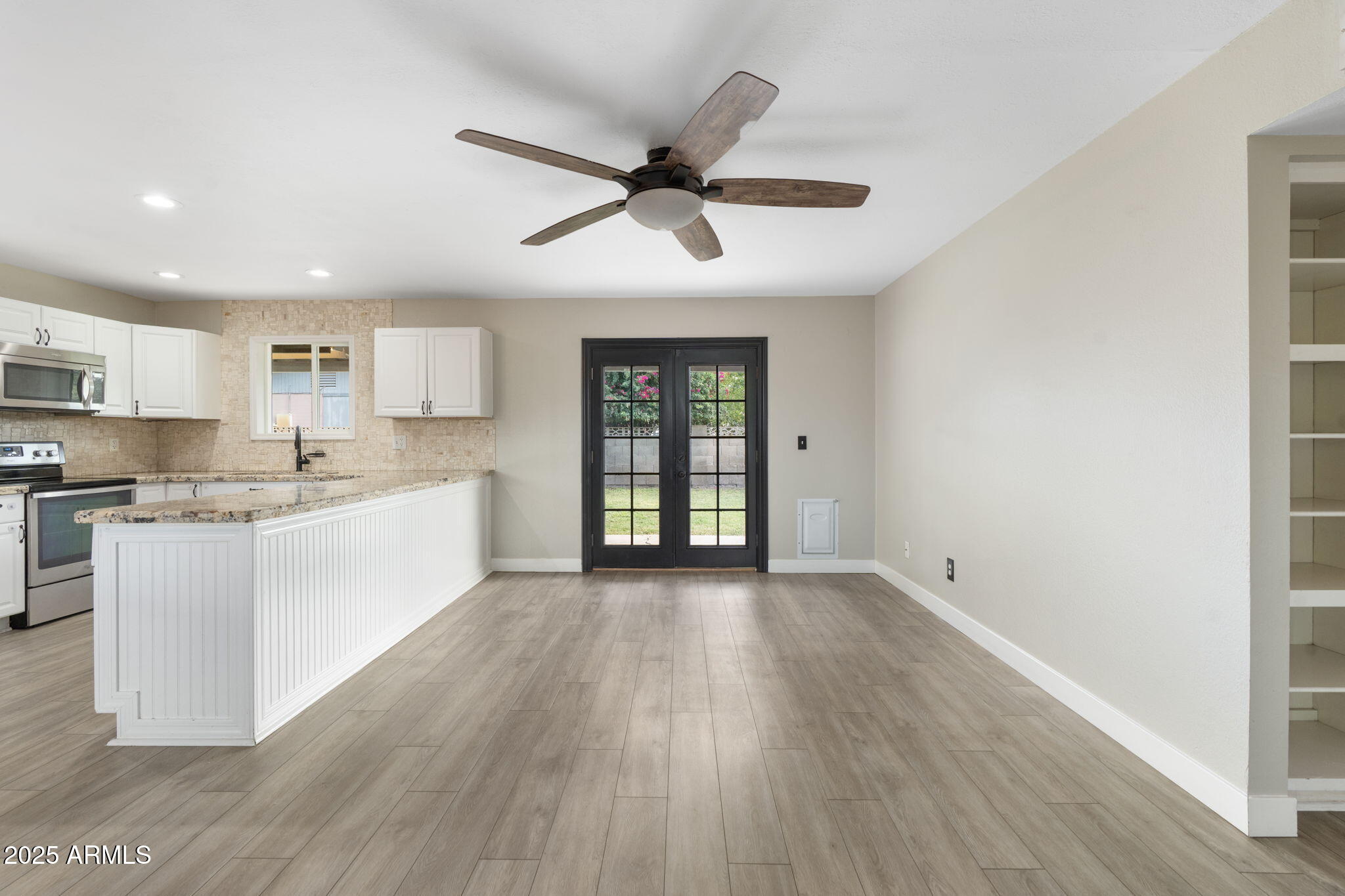 17 South Cholla Street Gilbert, AZ 85233 - Photo 6 of 37 a view of a kitchen with wooden floor and a window
