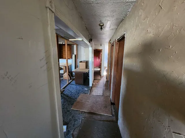 view of living room with furniture and a fireplace