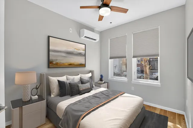 a bedroom with bed and window