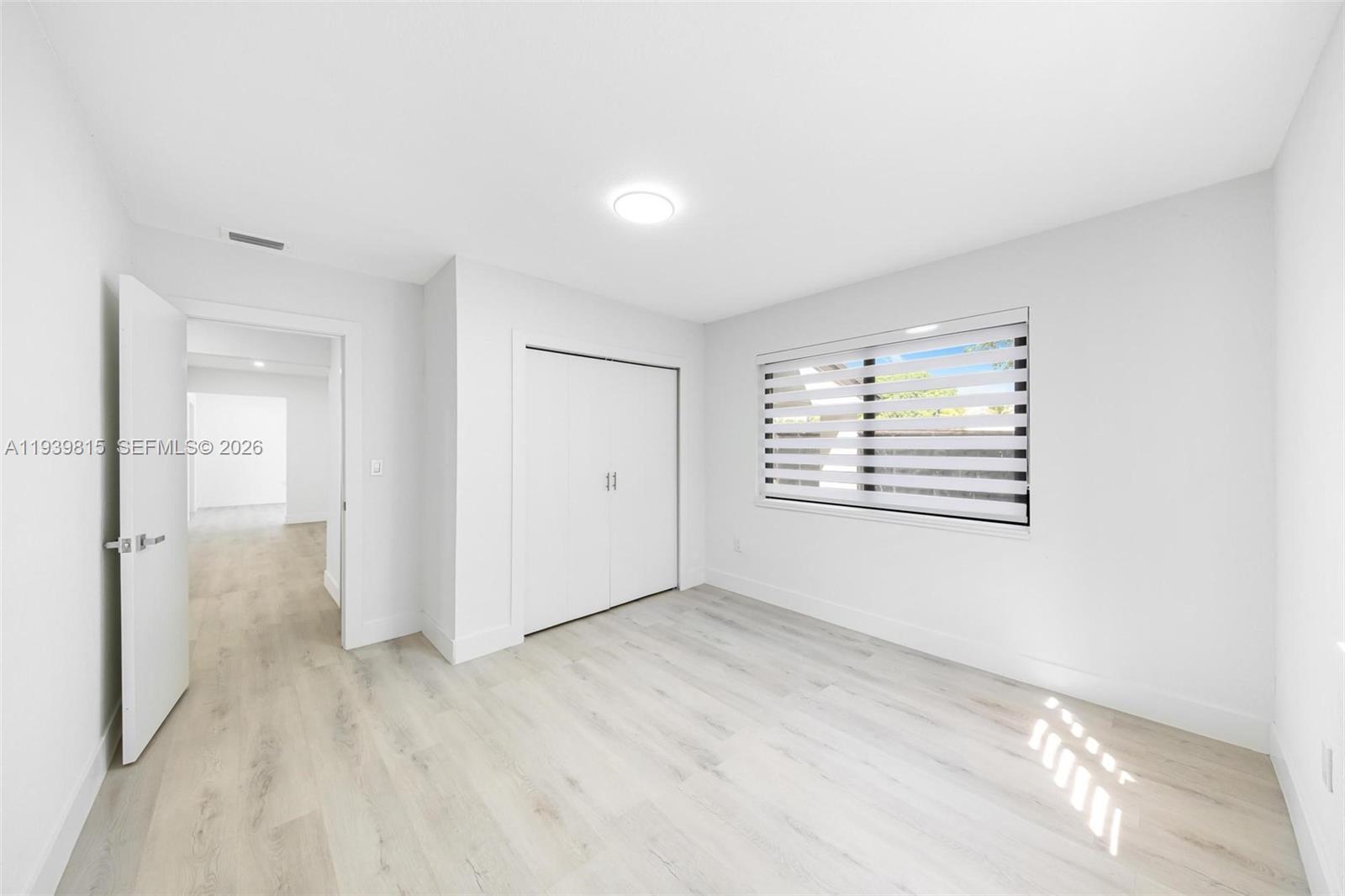 2250 Northwest 95th Street Miami, FL 33147 - Photo 14 of 26 wooden floor in an empty room