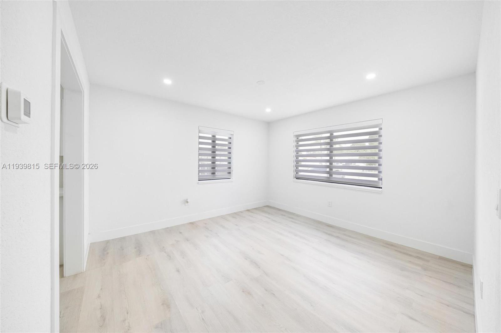 2250 Northwest 95th Street Miami, FL 33147 - Photo 7 of 26 an empty room with windows