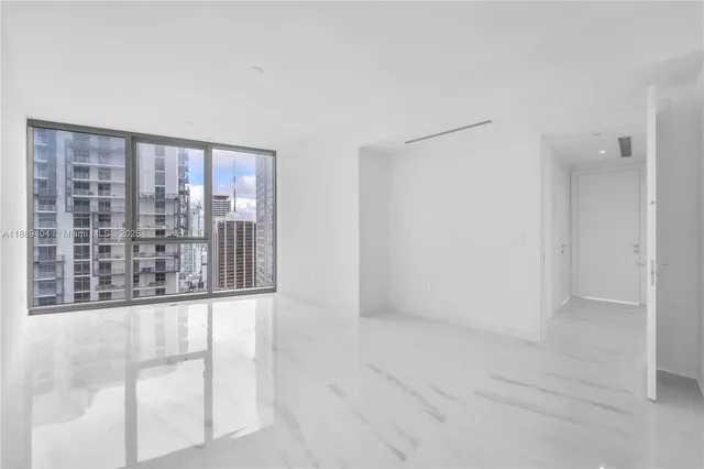 a view of an empty room with a window