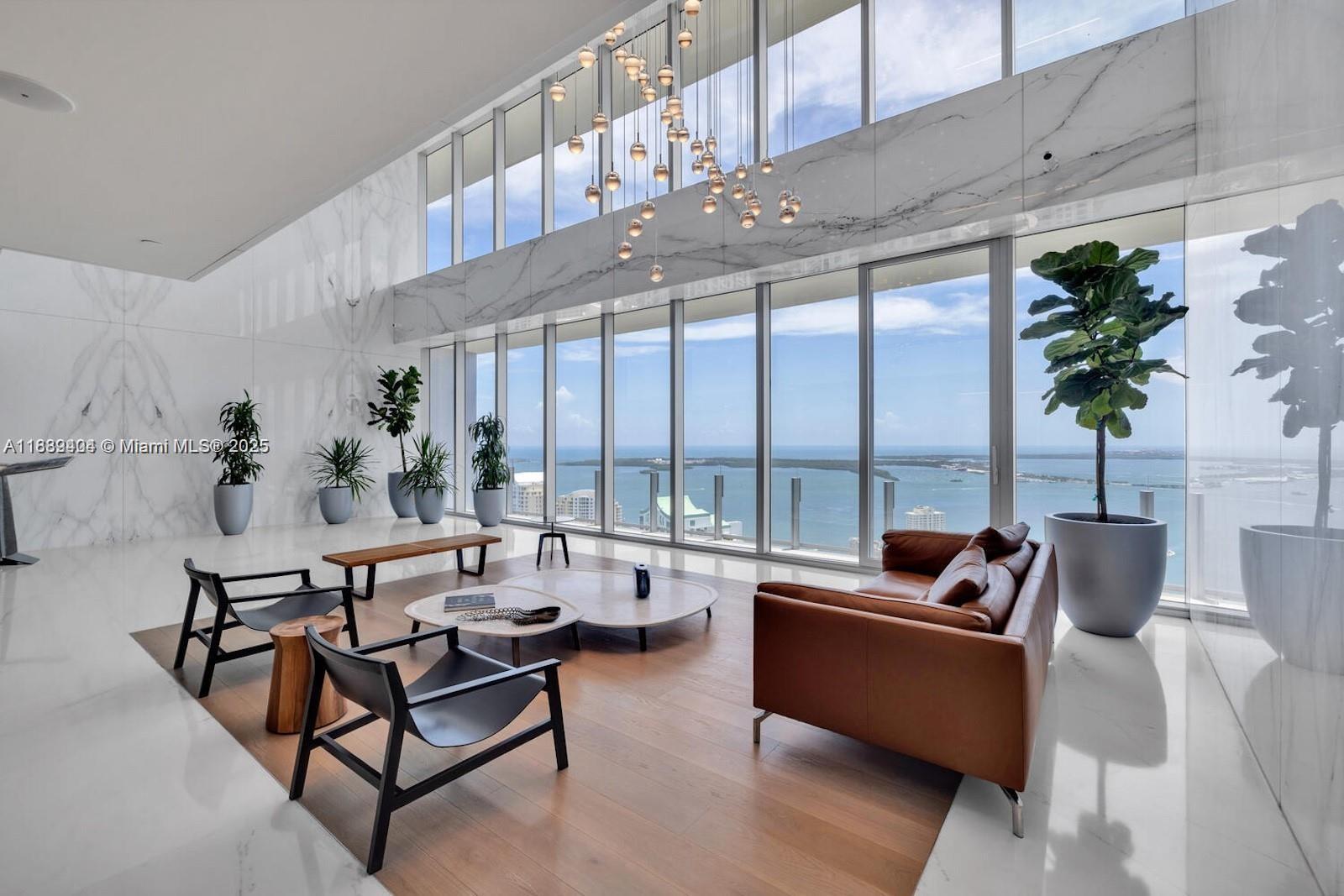 300 Biscayne Blvd Way, Unit 3602E Miami, FL 33131 - Photo 16 of 19 a living room with furniture tv and a large window