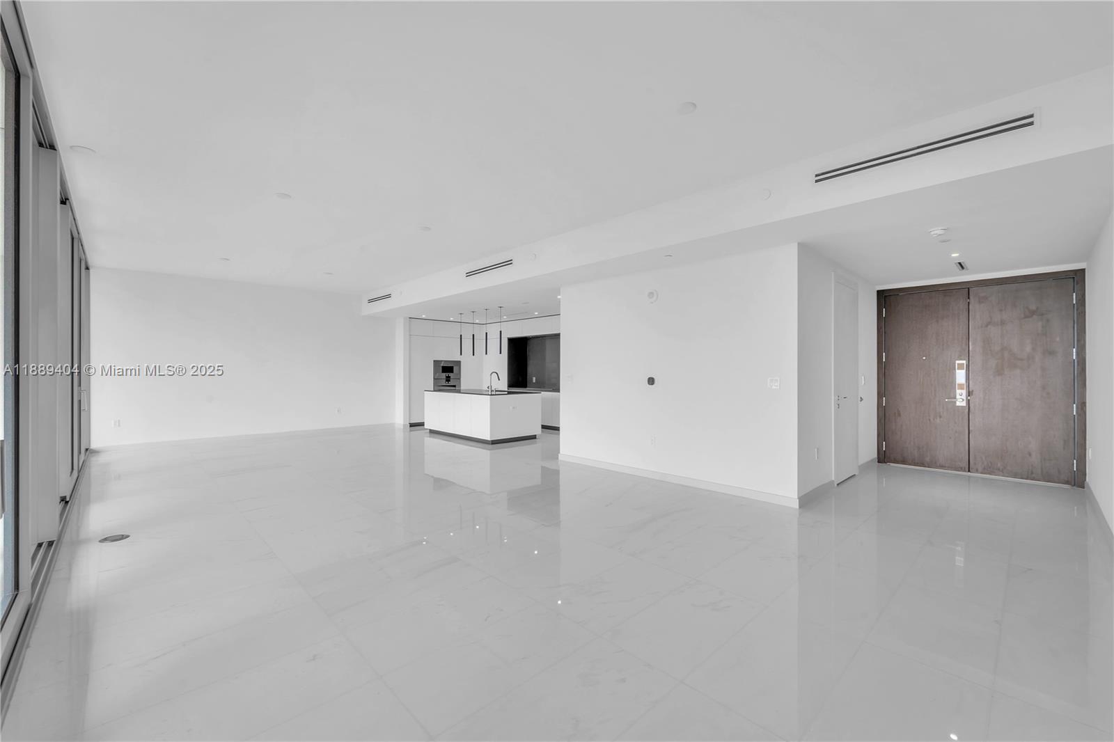 300 Biscayne Blvd Way, Unit 3602E Miami, FL 33131 - Photo 5 of 19 a view of a livingroom with an empty space and a workspace