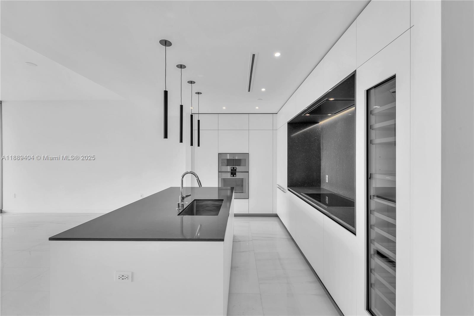 300 Biscayne Blvd Way, Unit 3602E Miami, FL 33131 - Photo 7 of 19 a kitchen with stainless steel appliances granite countertop a sink and a refrigerator
