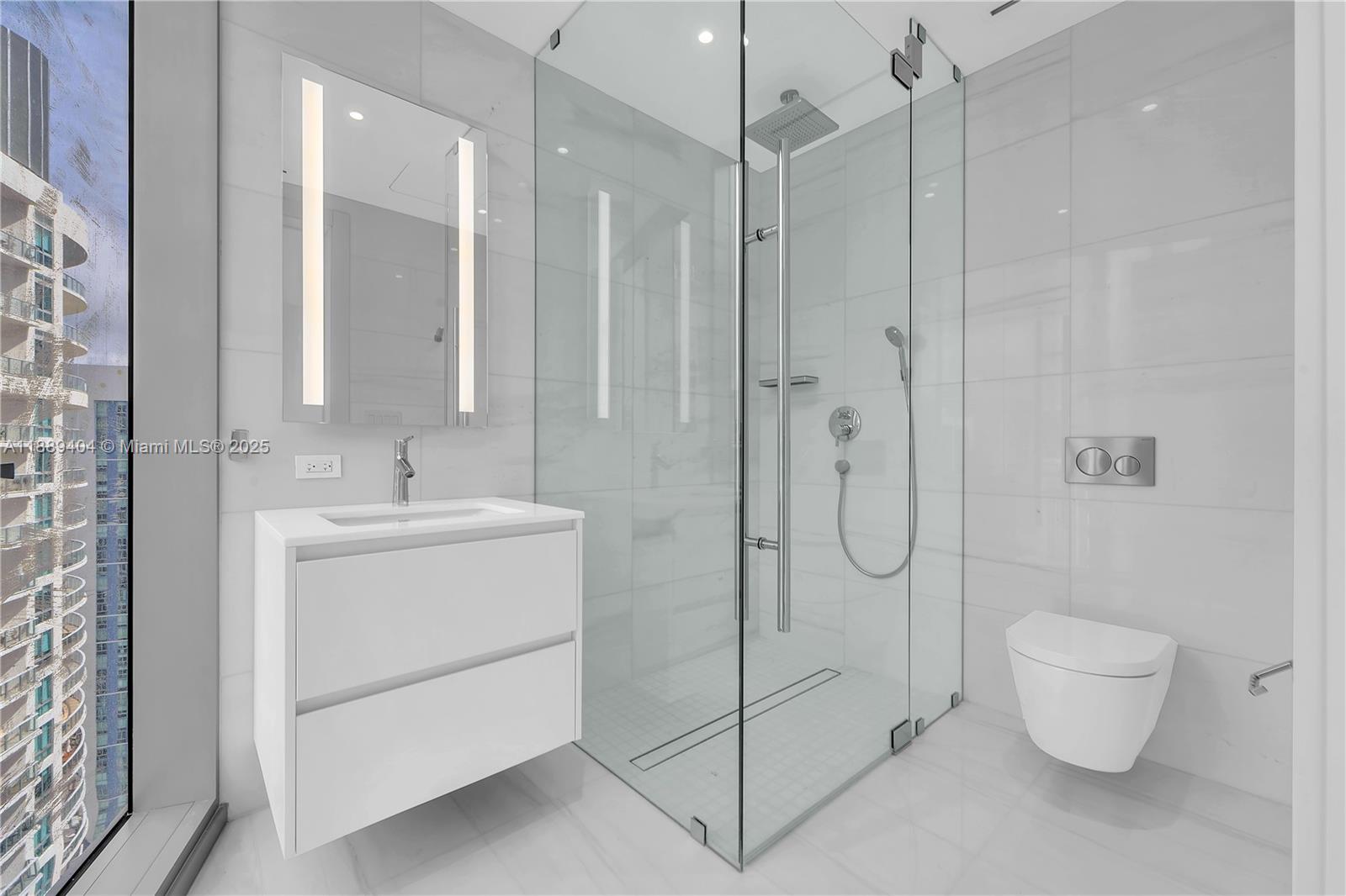 300 Biscayne Blvd Way, Unit 3602E Miami, FL 33131 - Photo 10 of 19 a bathroom with a shower toilet and sink