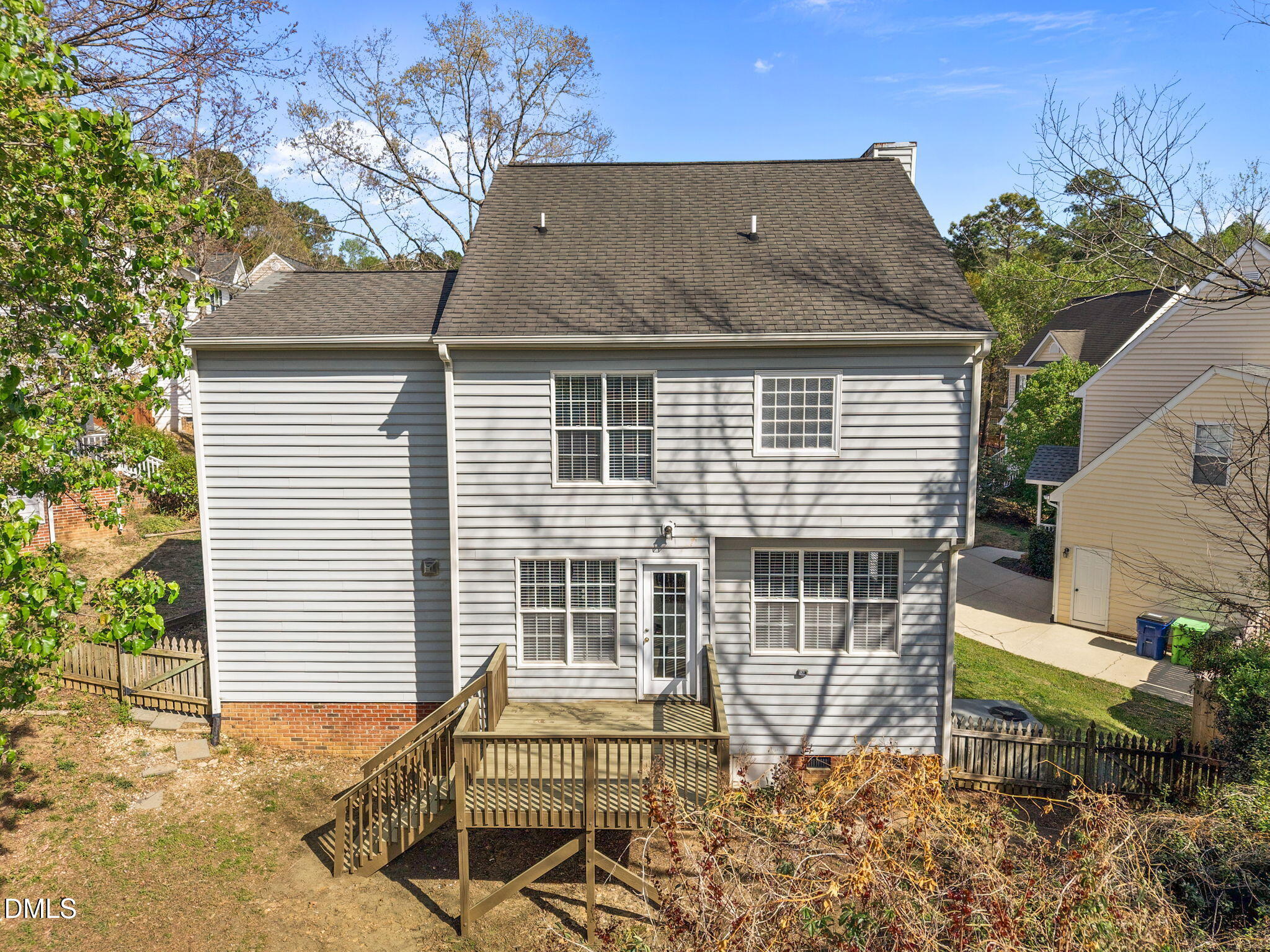 9220 Pennythorne Court Raleigh, NC 27615 - Photo 36 of 49 a view of a house with a yard and sitting area