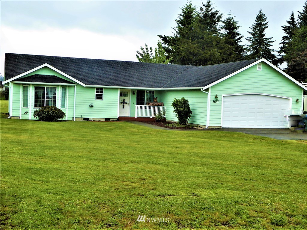 8637 194th Avenue Southwest Rochester, WA 98579 - Photo 1 of 37 a front view of a house with garden
