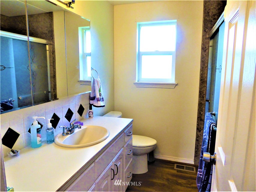 8637 194th Avenue Southwest Rochester, WA 98579 - Photo 17 of 37 a bathroom with a sink and a mirror