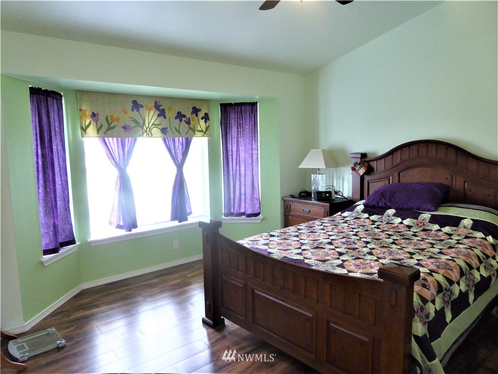 8637 194th Avenue Southwest Rochester, WA 98579 - Photo 18 of 37 a bedroom with a bed and a window