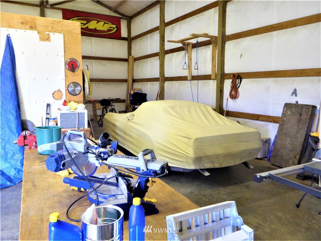 8637 194th Avenue Southwest Rochester, WA 98579 - Photo 27 of 37 a bed sitting in a bedroom next to a window