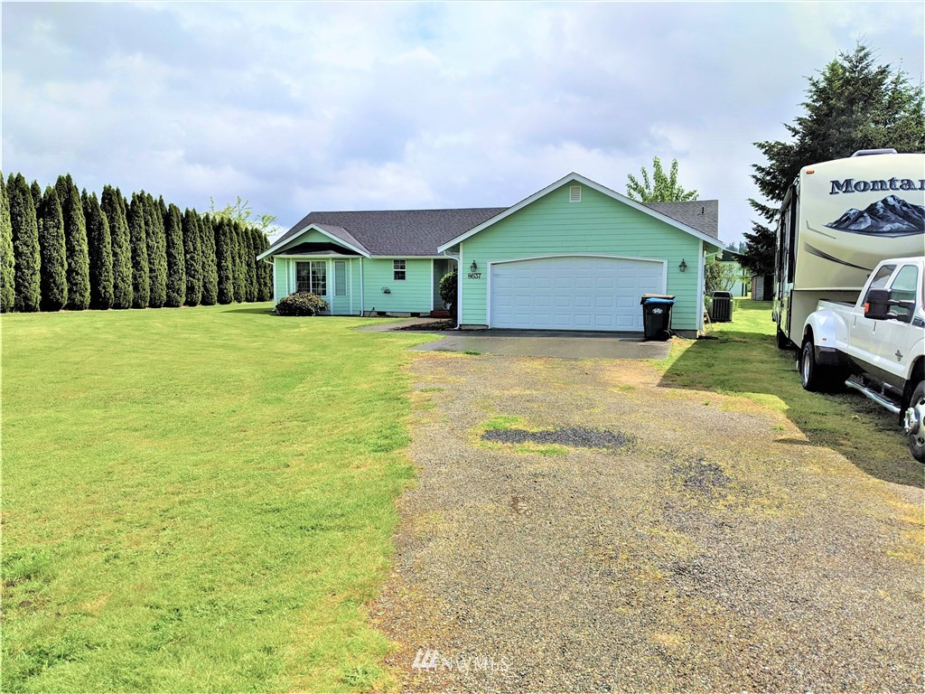 8637 194th Avenue Southwest Rochester, WA 98579 - Photo 5 of 37 a house view with a garden space